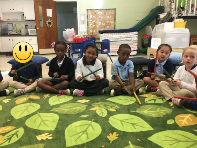 Music time with rhythm sticks.