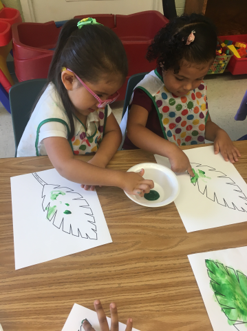 Painting palm branches for the Bible lesson.