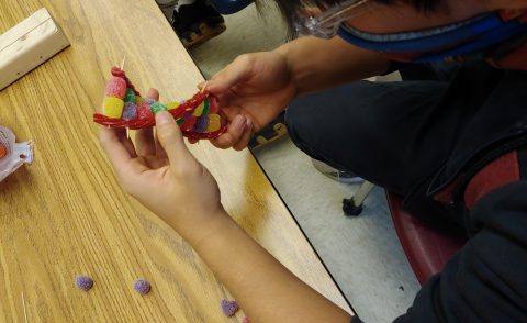 Aline and Hser Tha build models of DNA.